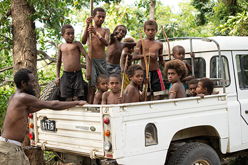 Pickup Truck filled with kids from Vanuatu
